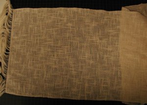 Lightweight-Flake-scarf,-natural, before finishing, handwoven by Joanne Littler, Pine Ledge Fiber Studio Photo of woven fabric, natural cotton, with slub yarn creating plaid effect.