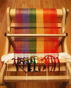 Rigid Heddle Loom Ready to Weave Photo of rainbowcolored warp on small rigid heddle loom