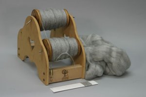 Gray Alpaca/Silk Siingles, Fiber and Sample Cards Photo of Lazy Kate with 2 full bobbins, starting fiber and sample card