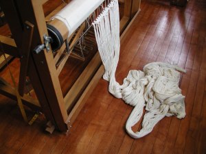 photo of cotton threads, cut from the loom