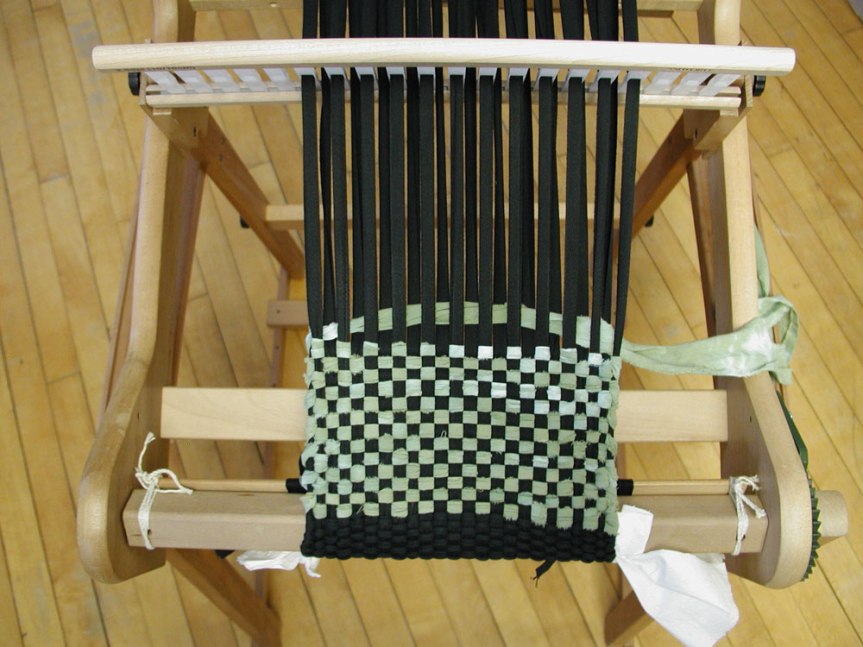 photo showing 16" RH loom set up with twill tape warp, using hand dyed fabric strips as weft.